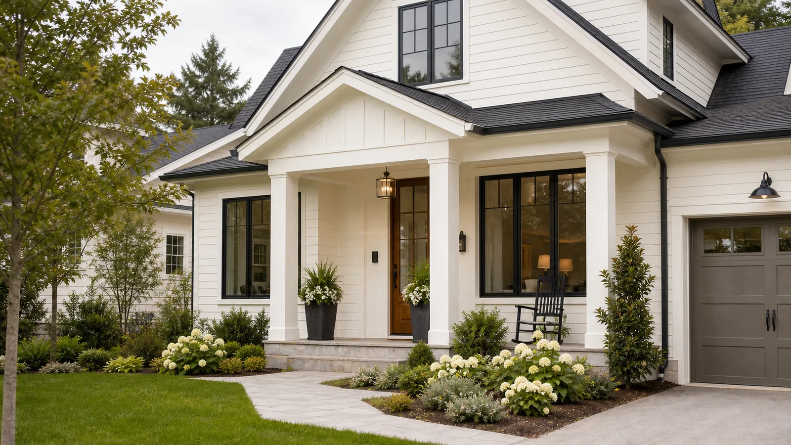 Warm white exterior house with soft trim contrast and natural wood accents in daylight