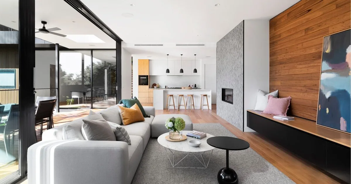 Three sample walls finished in microcement, limewash, and tadelakt side-by-side